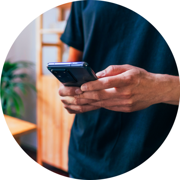 man typing on mobile phone